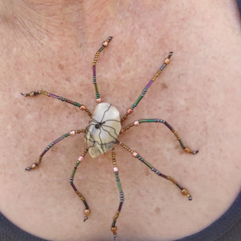 Raw quarts crystal wire wrapped beaded spider.